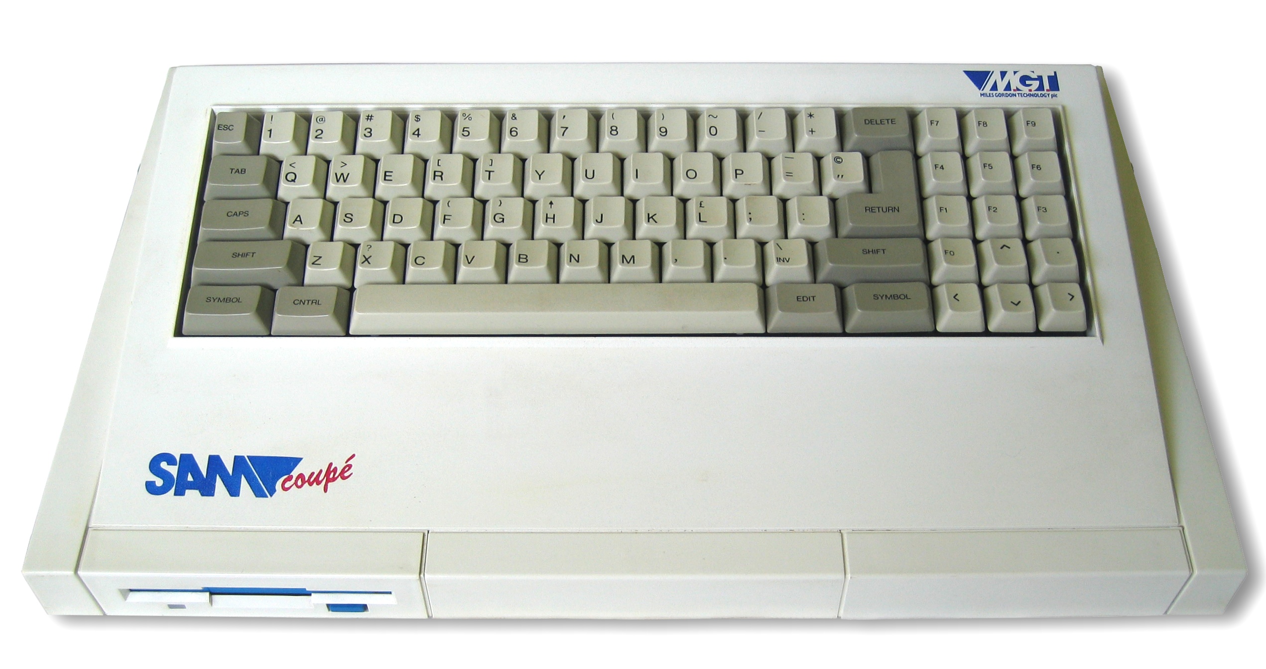 Clavier externe de l'ordinateur SAM Coupé avec logo et port de connexion visible, design rétro années 1980