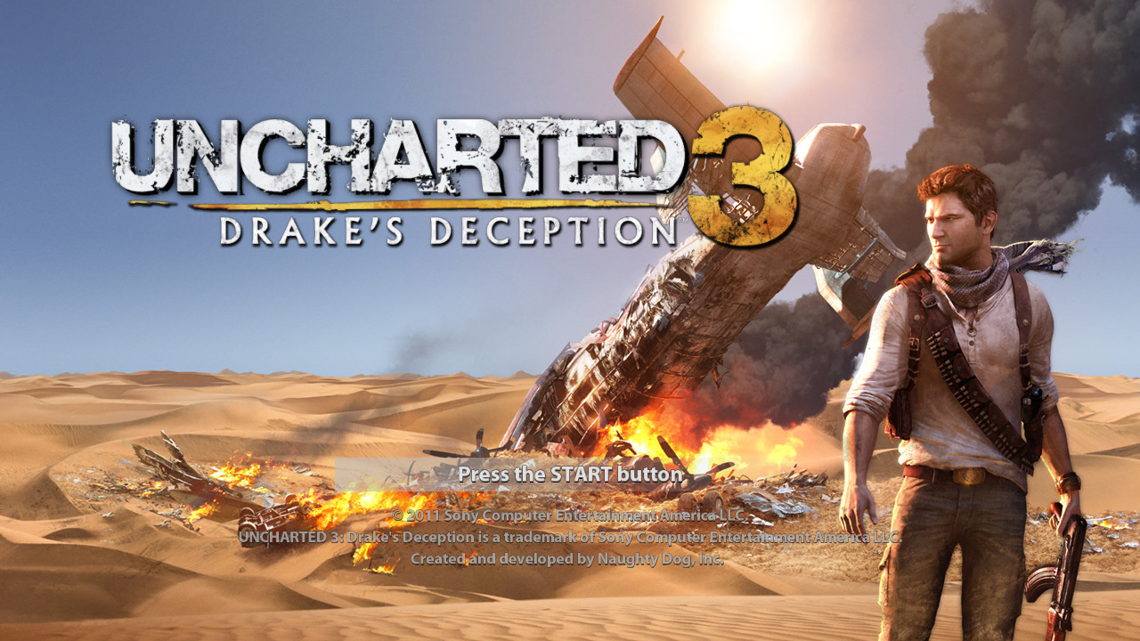 Écran de démarrage du jeu "Uncharted 3 : L'Illusion de Drake" montrant Nathan Drake dans un désert avec un avion en feu en arrière-plan